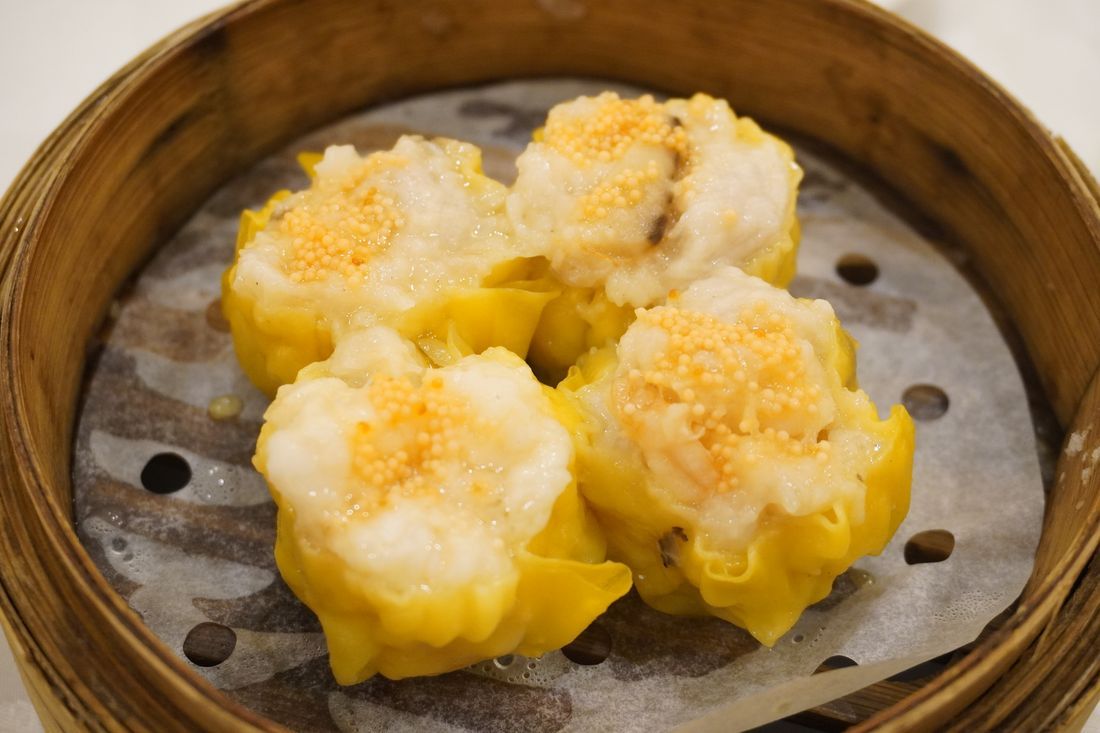 Steamed siu mai dumplings topped with roe