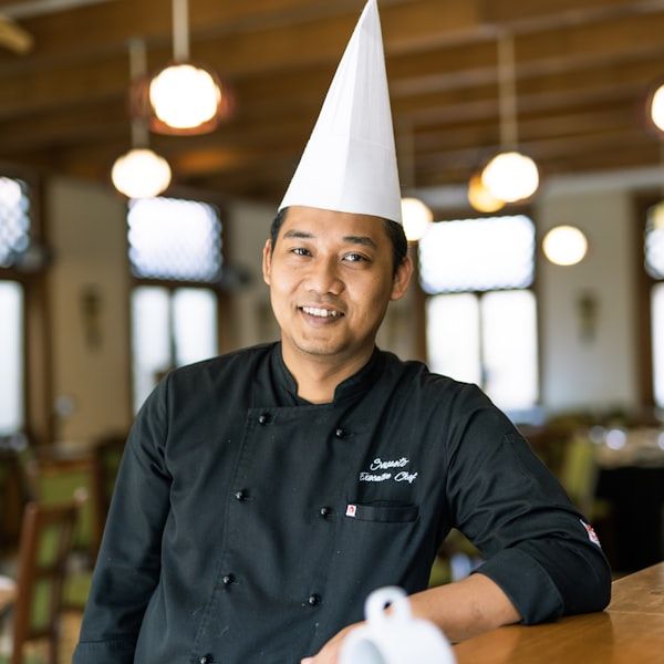 Chef working the charcoal grill in the open kitchen